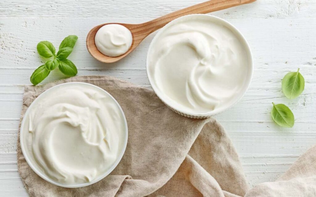 2 bowls of greek yogurt with spoon