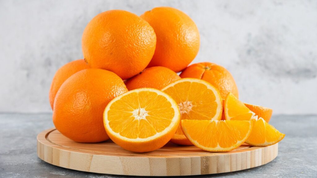 a bunch of oranges and slice oranges