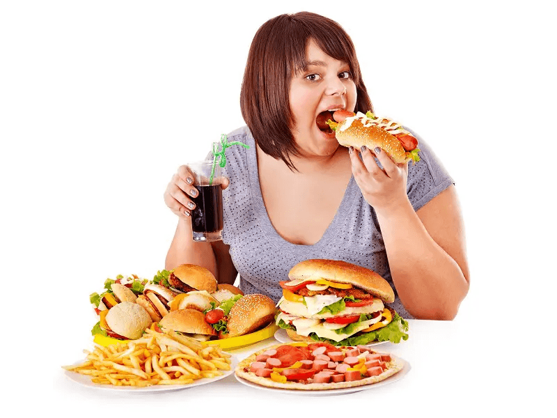 A woman eating junk food