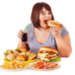 A woman eating junk food