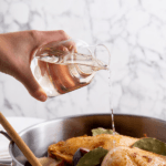 pouring vinegar in cooking